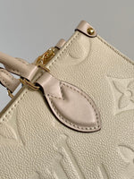 LV 25S ONTHEGO EAST WEST BAG 25 IN CREAM CALFSKIN MONOGRAM EMPREINTE