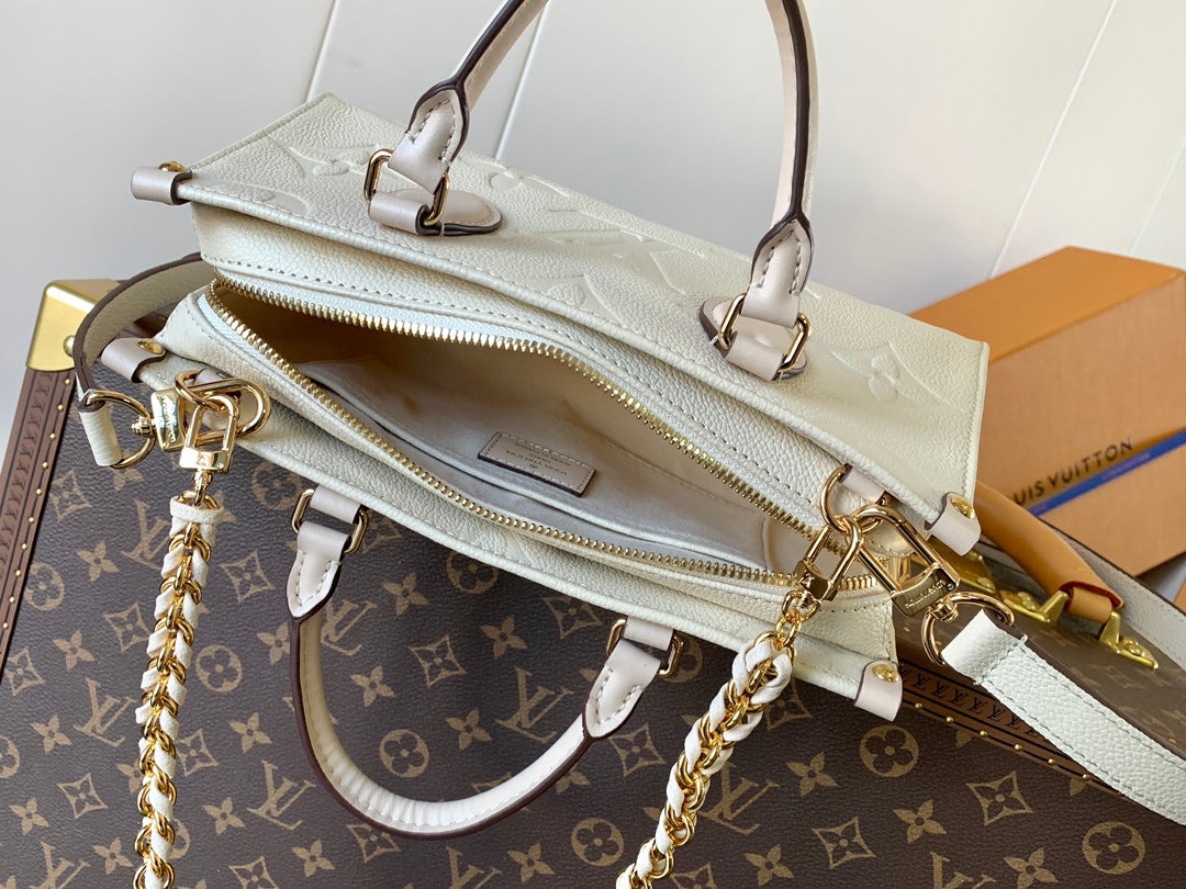 LV 25S ONTHEGO EAST WEST BAG 25 IN CREAM CALFSKIN MONOGRAM EMPREINTE