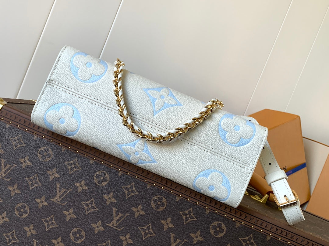 LV 25S ONTHEGO EAST WEST BAG 25 IN WHITE BLUE CALFSKIN MONOGRAM EMPREINTE