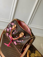 SPEEDY BANDOULIÈRE CHERRY BLOSSOM 25 IN SAKURA BROWN MONOGRAM COATED CANVAS