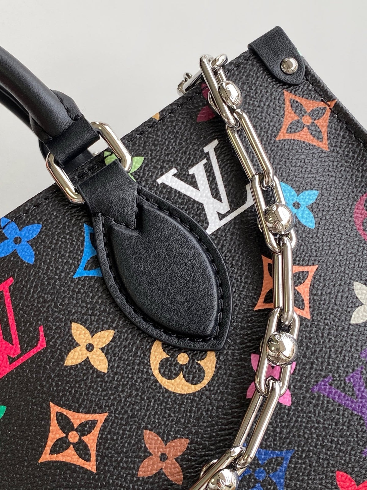 ONTHEGO EAST WEST BAG 25 IN COLORFUL MONOGRAM PATTERN CANVAS