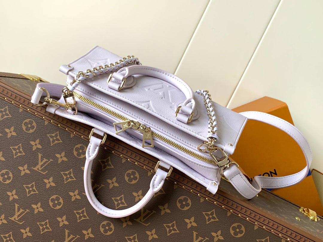 LV 25S ONTHEGO EAST WEST BAG 25 IN LIGHT LAVENDER CALFSKIN MONOGRAM EMPREINTE