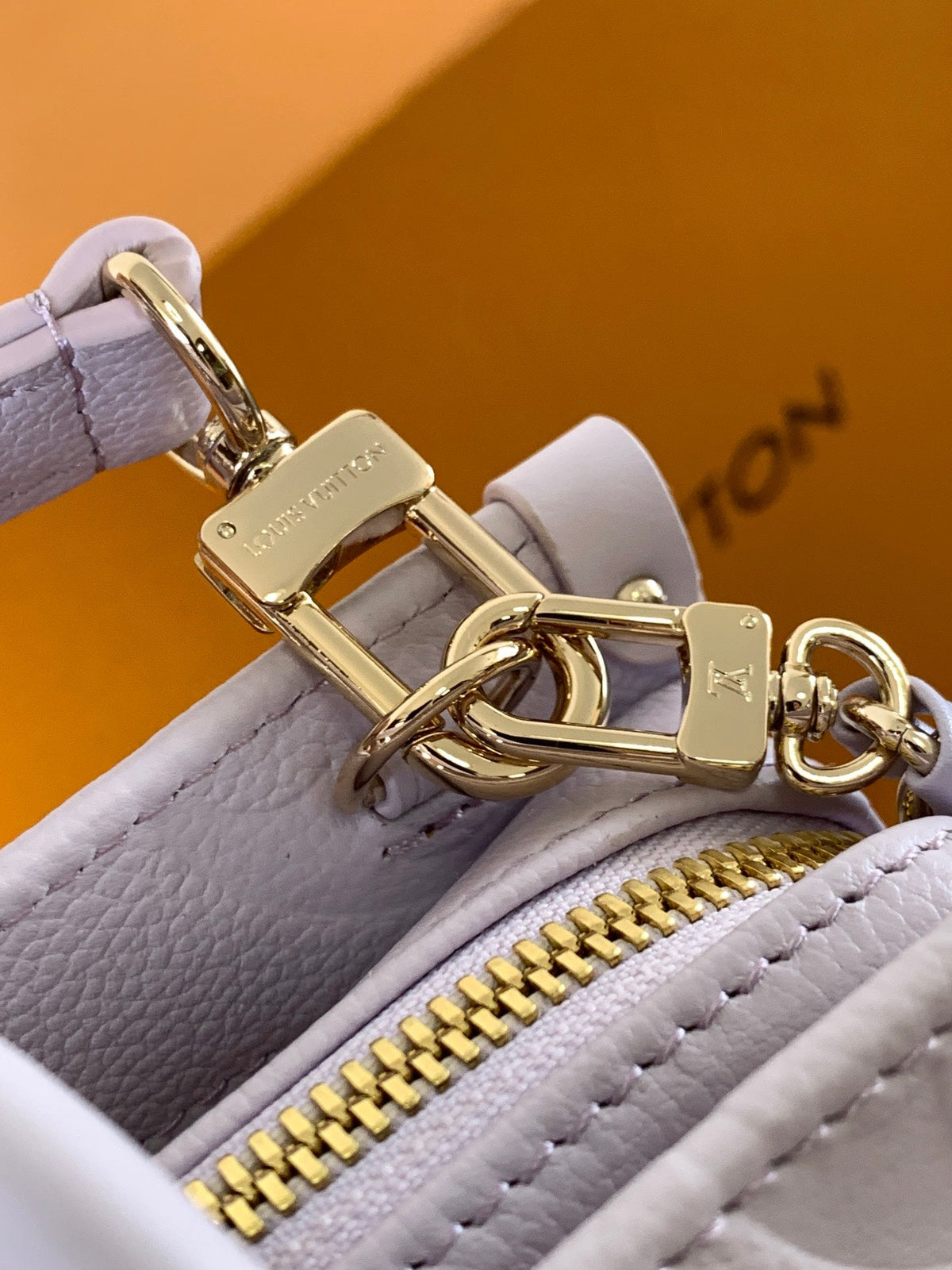 LV 25S ONTHEGO EAST WEST BAG 25 IN LIGHT LAVENDER CALFSKIN MONOGRAM EMPREINTE